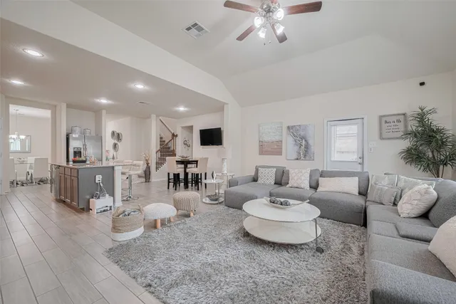 a bedroom with a large bed and a couch