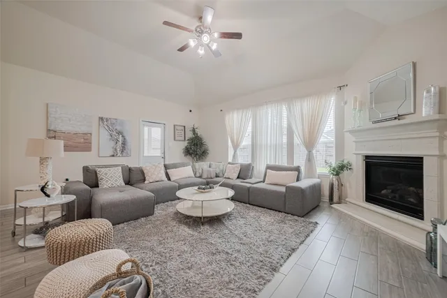 a living room with furniture and a fireplace