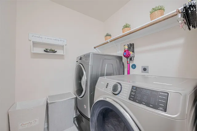 a bedroom with a bed and a potted plant