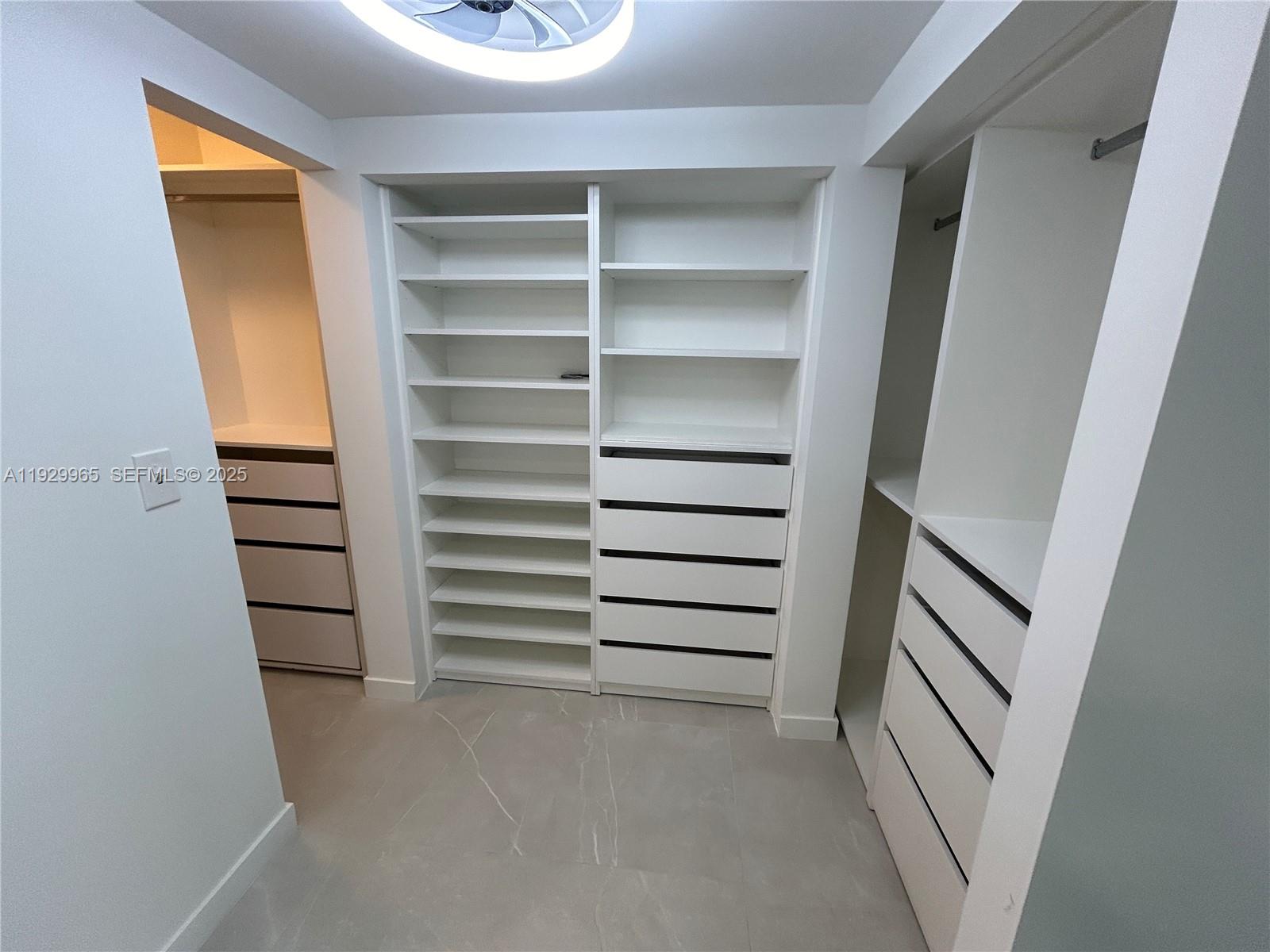 177 Ocean Ln Drive, Unit 715 Key Biscayne, FL 33149 - Photo 11 of 24 a view of walk in closet with empty racks