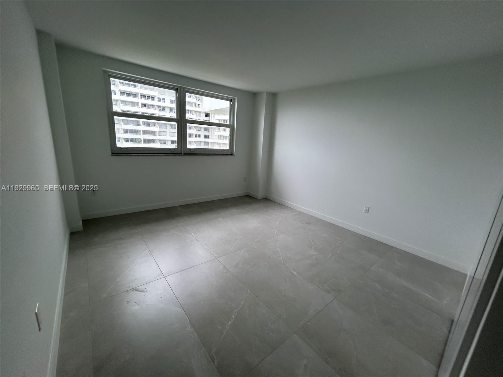 177 Ocean Ln Drive, Unit 715 Key Biscayne, FL 33149 - Photo 16 of 24 an empty room with windows