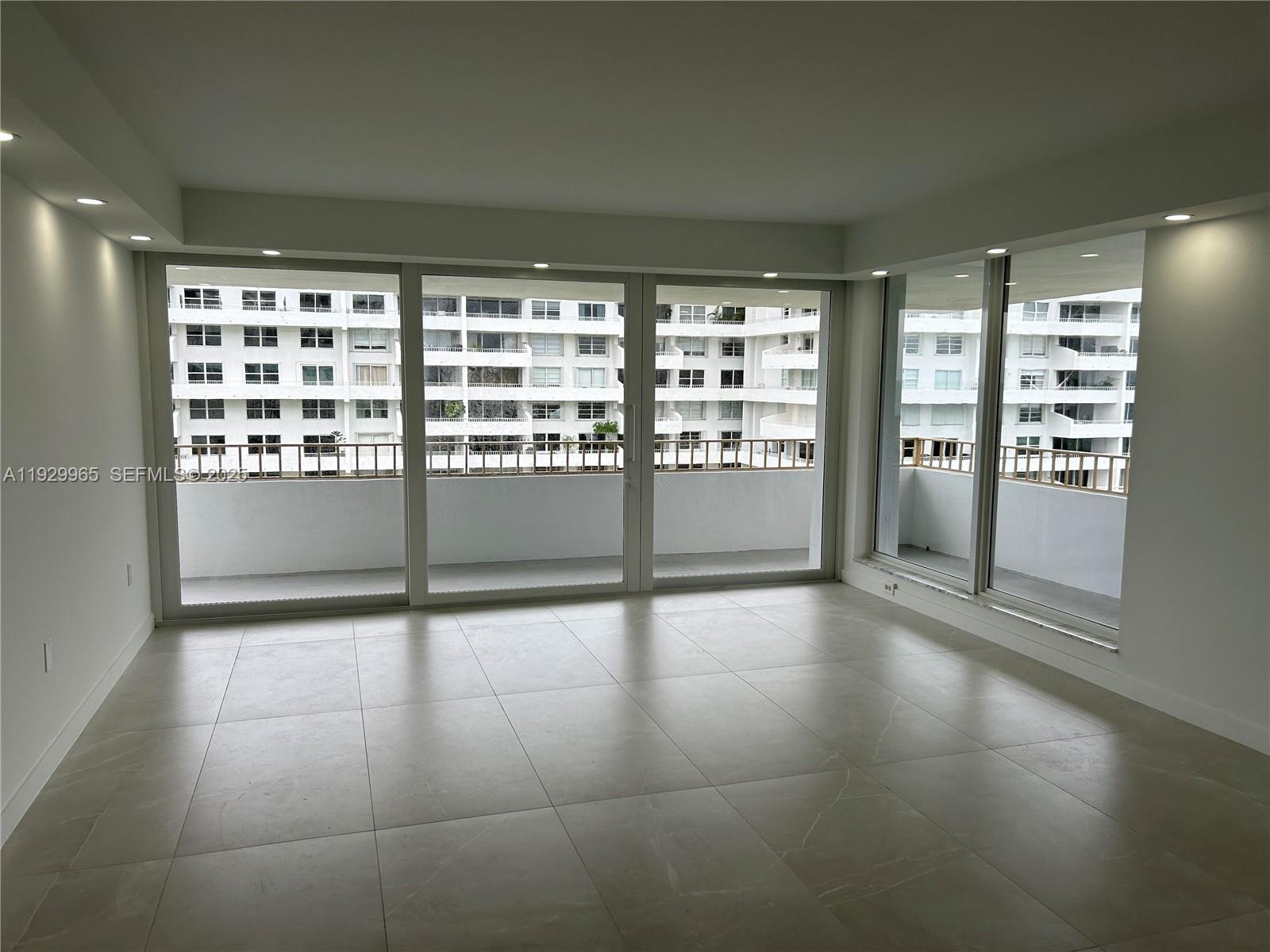 177 Ocean Ln Drive, Unit 715 Key Biscayne, FL 33149 - Photo 4 of 24 a view of an empty room with a window