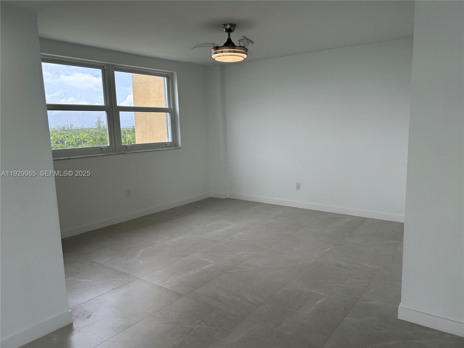 177 Ocean Ln Drive, Unit 715 Key Biscayne, FL 33149 - Photo 6 of 24 an empty room with windows