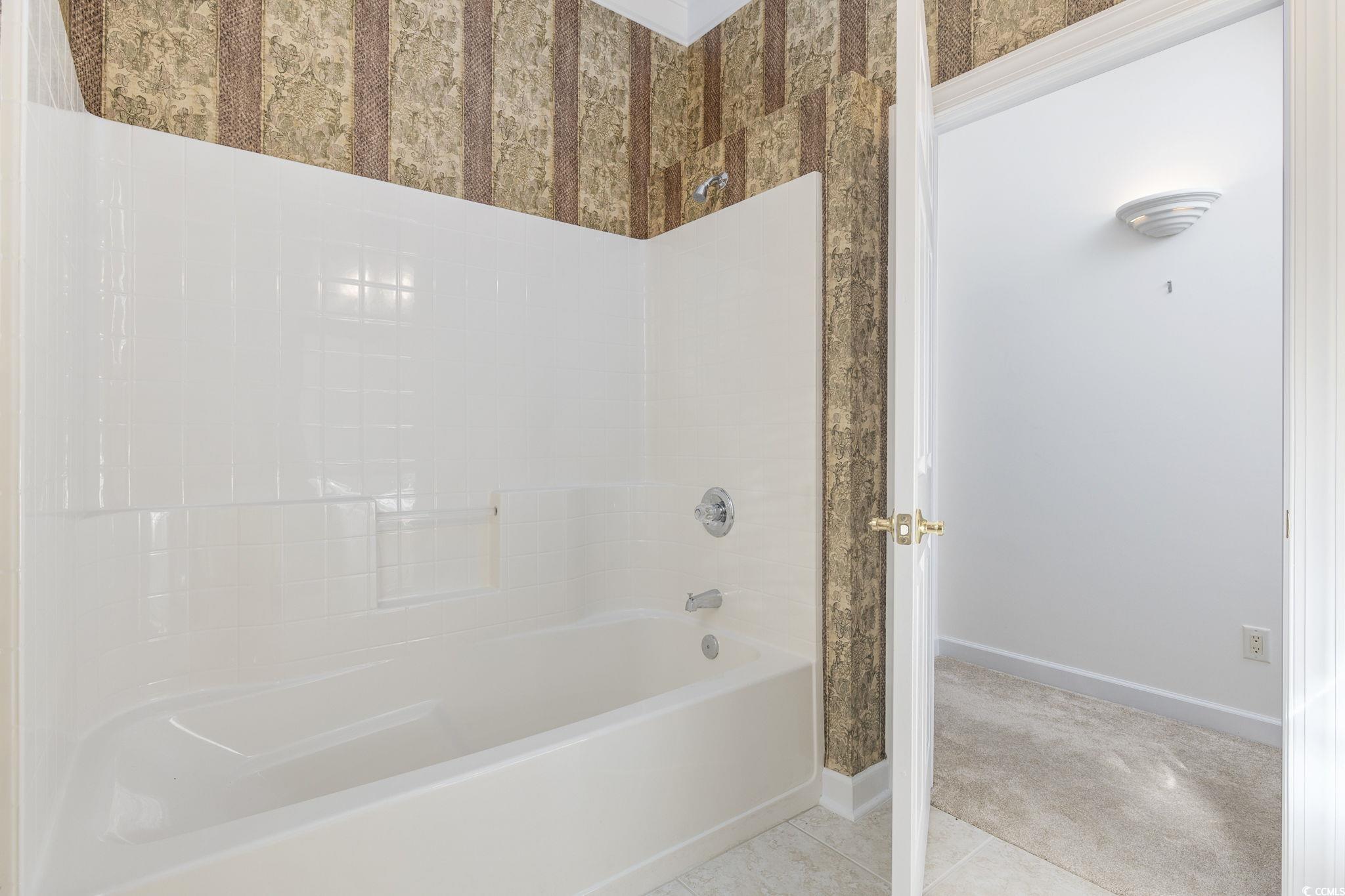 4567 Carriage Run Circle Murrells Inlet, SC 29576 - Photo 21 of 40 Bathroom with tile patterned flooring and tub / sh