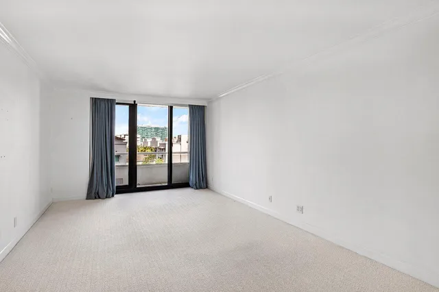 an empty room with windows and view