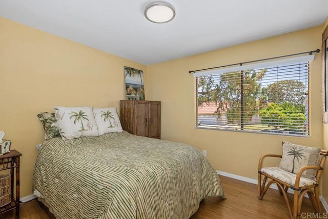 a bedroom with bed and window