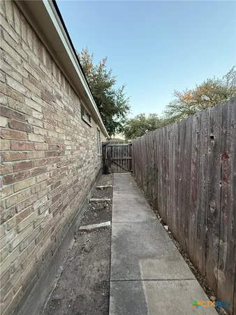 a view of a backyard of the house