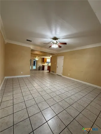 a view of a livingroom and window