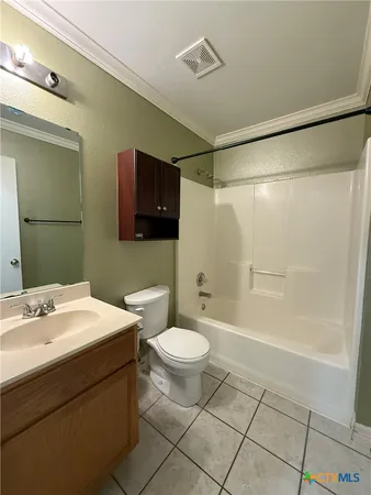 an empty room with a ceiling fan and window