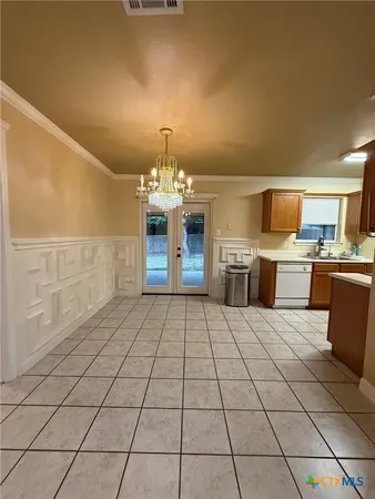 a kitchen with stainless steel appliances a sink stove and cabinets