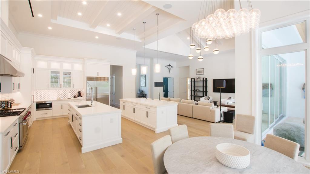 700 Wedge Drive Naples, FL 34103 - Photo 6 of 19 a living room with furniture and a large window