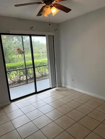 a view of a livingroom with a projector and a window