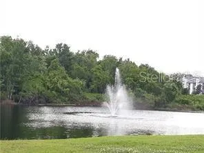 a view of lake from front of house with trees