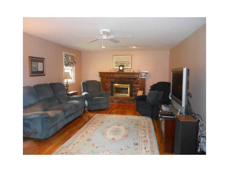 115 Taylor Road Portsmouth, RI 02871 - Photo 6 of 25 Den/Family/Great Room. Large family room with gas fireplace. French doors open to back deck. Great for entertaining!