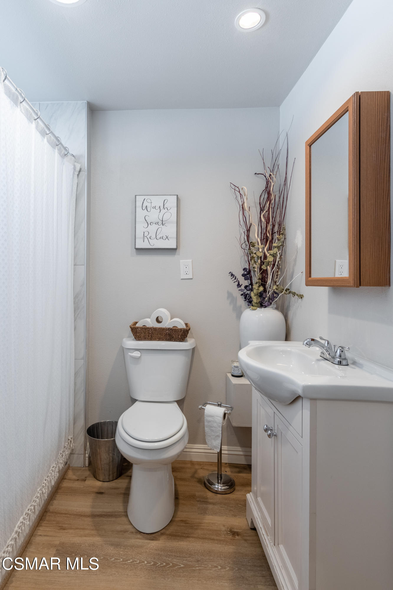 5935 Oak Knolls Road Simi Valley, CA 93063 - Photo 14 of 24 a bathroom with a toilet sink and mirror