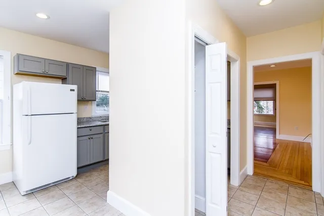 a view of a kitchen with a refrigerator and a refrigerator