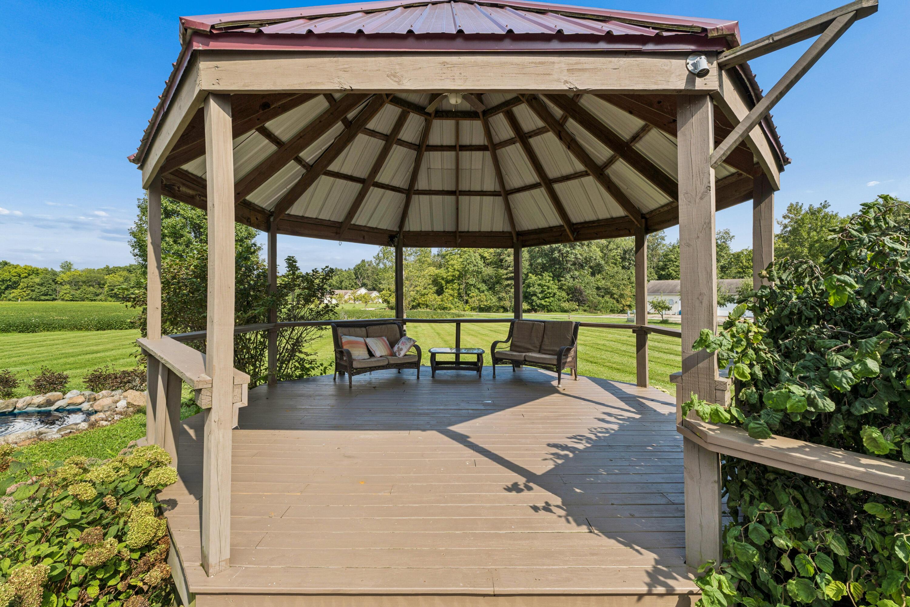 18964 London Road Circleville, OH 43113 - Photo 17 of 57 Octagonal wood-finish gazebo with a metal roof and a spacious deck