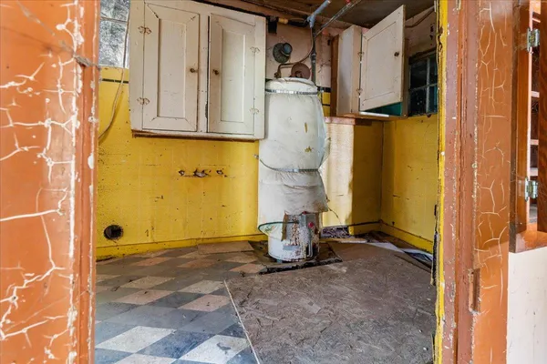 a white toilet sitting next to a bathroom sink