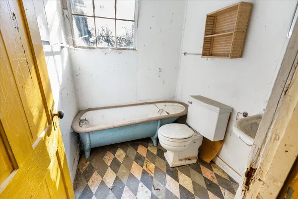 a bathroom with a toilet and a sink
