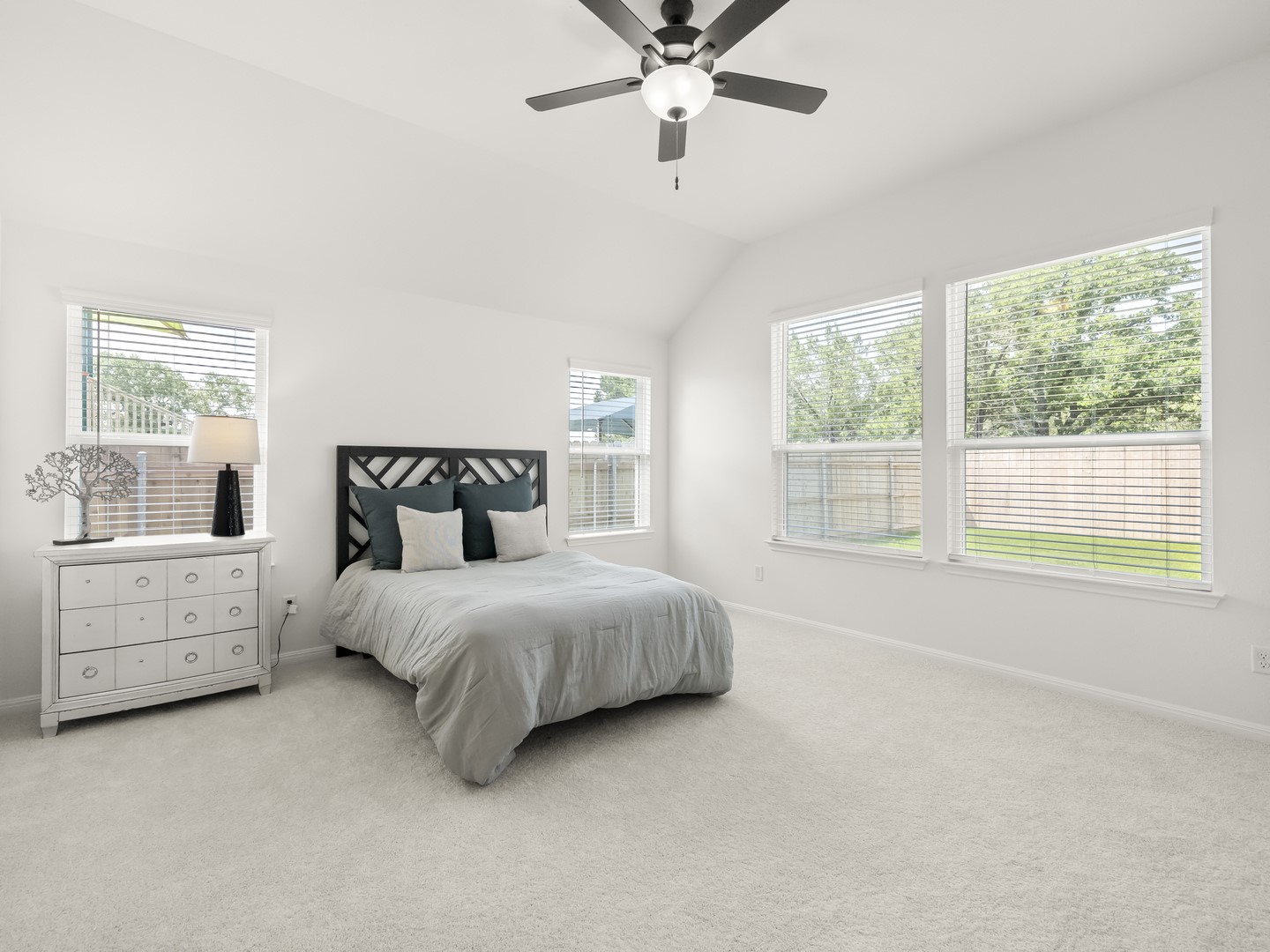 402 Judson Street Bertram, TX 78605 - Photo 11 of 27 a spacious bedroom with a bed and a window