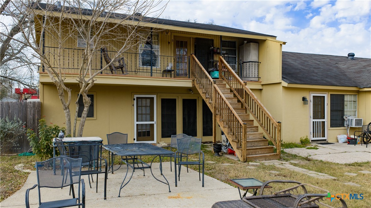 613 East Broadway Street, Unit 5 Cuero, TX 77954 - Photo 25 of 34 a view of house with a outdoor space