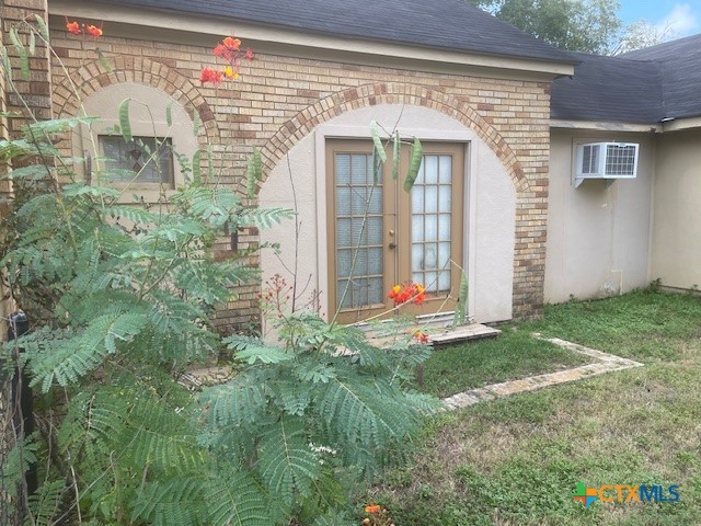 613 East Broadway Street, Unit 5 Cuero, TX 77954 - Photo 3 of 34 a front view of a house with a yard