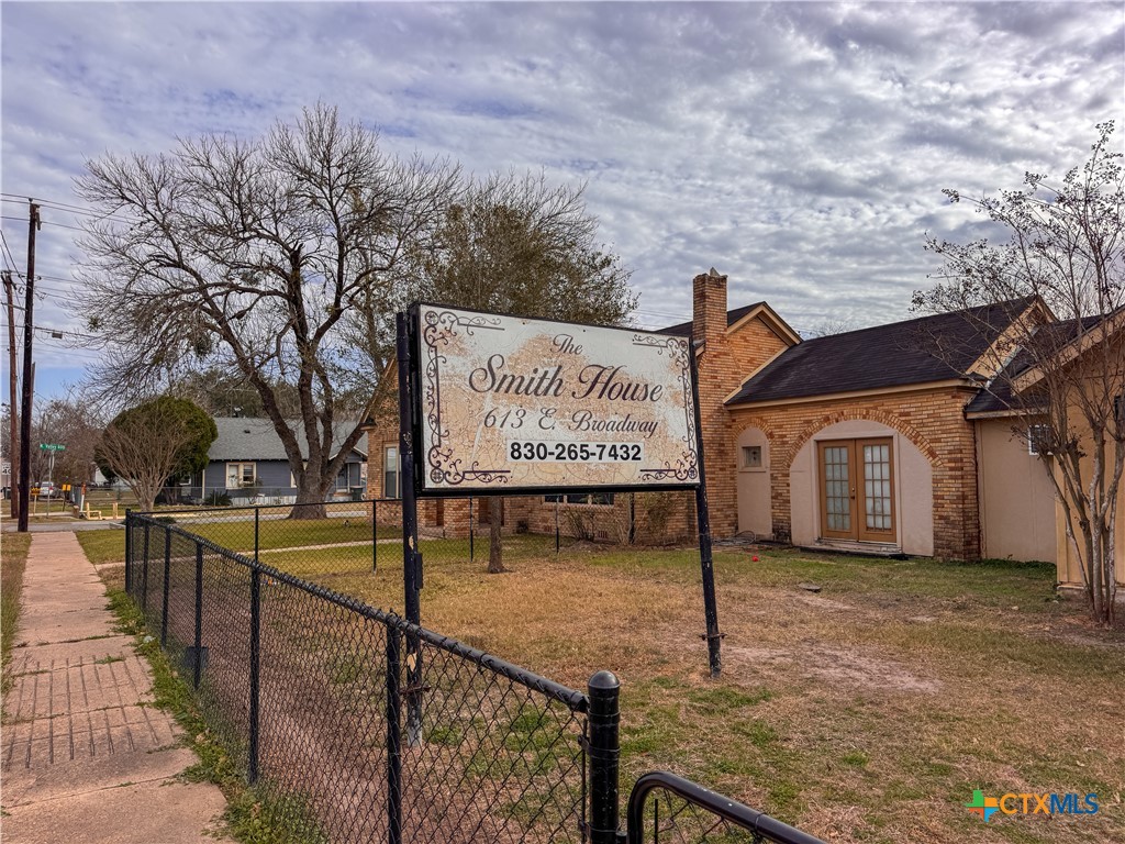 613 East Broadway Street, Unit 5 Cuero, TX 77954 - Photo 34 of 34 a view of a street with potted plants in front of it