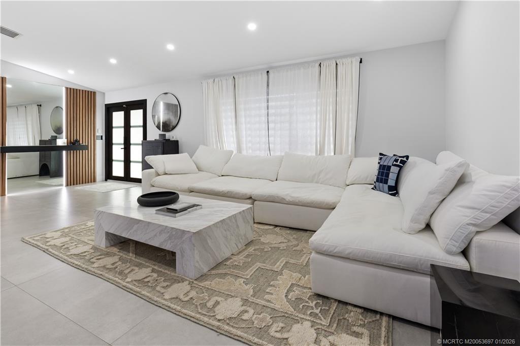 5143 Deerhurst Crescent Circle Boca Raton, FL 33486 - Photo 31 of 47 a living room with furniture and a wooden floor