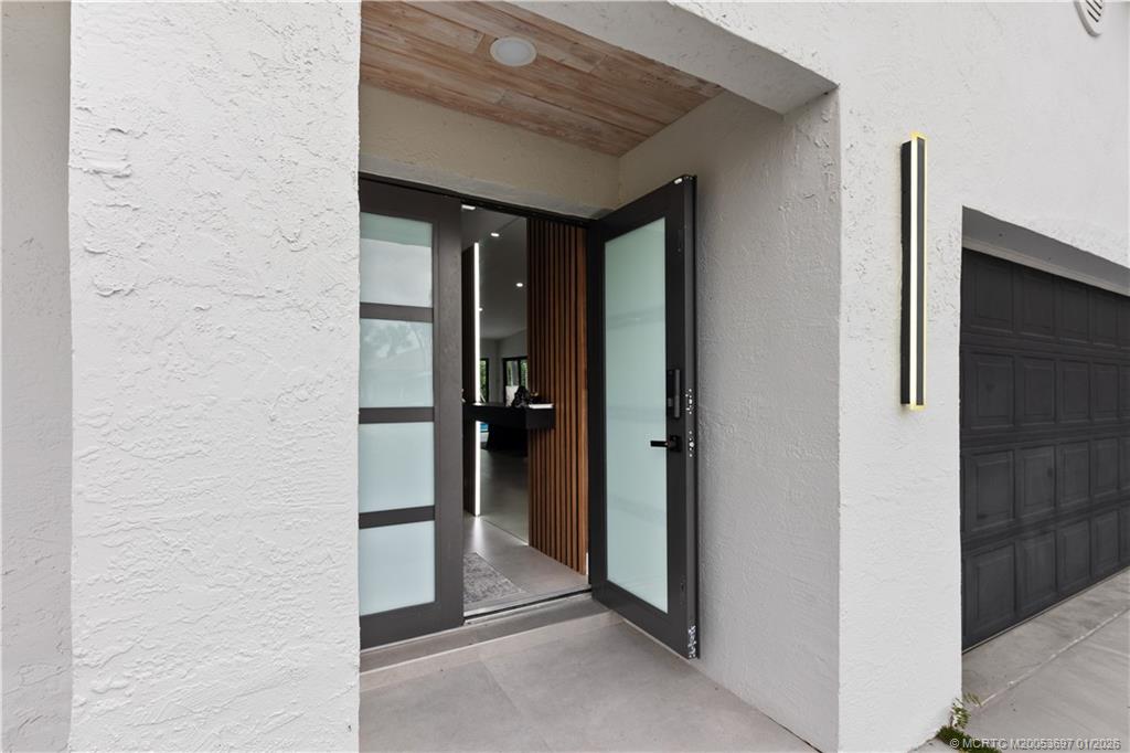 5143 Deerhurst Crescent Circle Boca Raton, FL 33486 - Photo 35 of 47 a view of a hallway with a elevator
