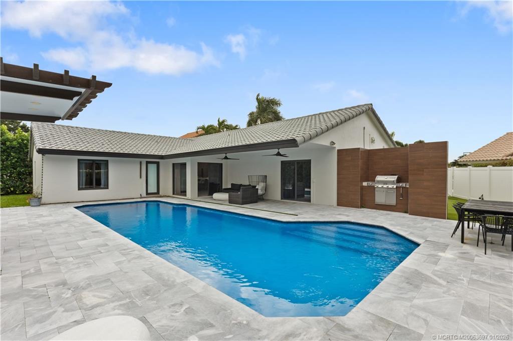 5143 Deerhurst Crescent Circle Boca Raton, FL 33486 - Photo 38 of 47 a view of outdoor space yard swimming pool and porch