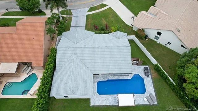 an aerial view of house with yard