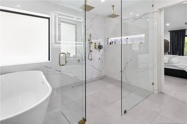 a bathroom with a shower and a sink