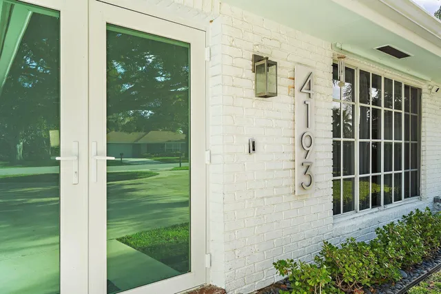 a bathroom with a shower and a sink