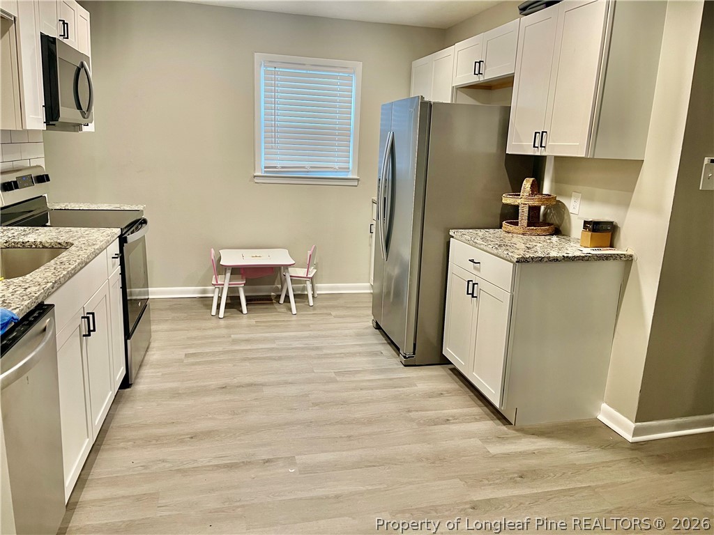 3610 Yorktown Road Hope Mills, NC 28348 - Photo 8 of 30 a kitchen with a sink appliances and cabinets