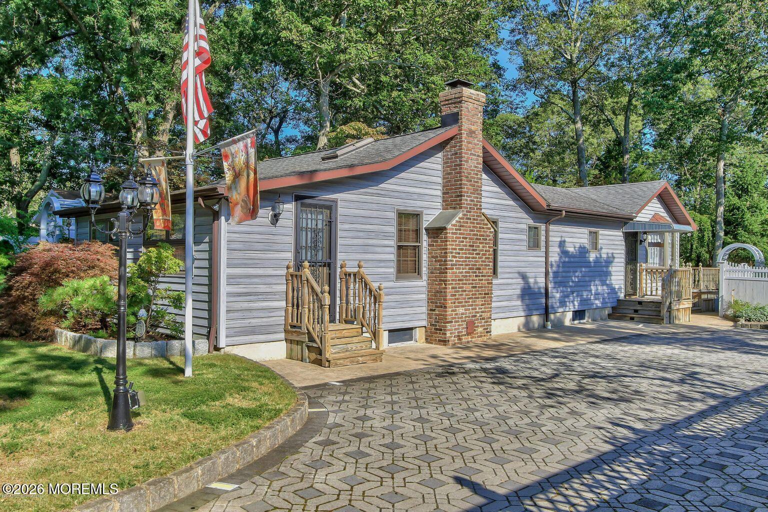 331 Morris Boulevard Toms River, NJ 08753 - Photo 1 of 33 a front view of a house with garden