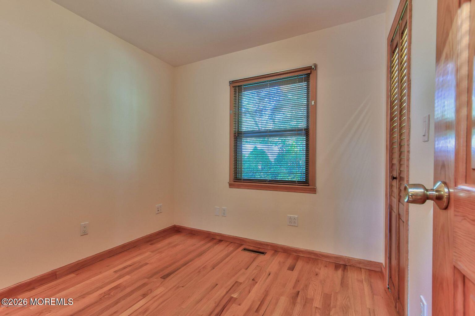 331 Morris Boulevard Toms River, NJ 08753 - Photo 17 of 33 wooden floor in an empty room