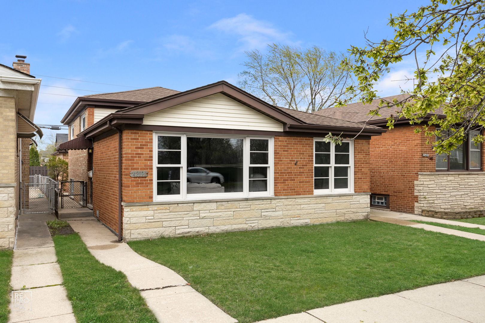 front view of a house with a yard