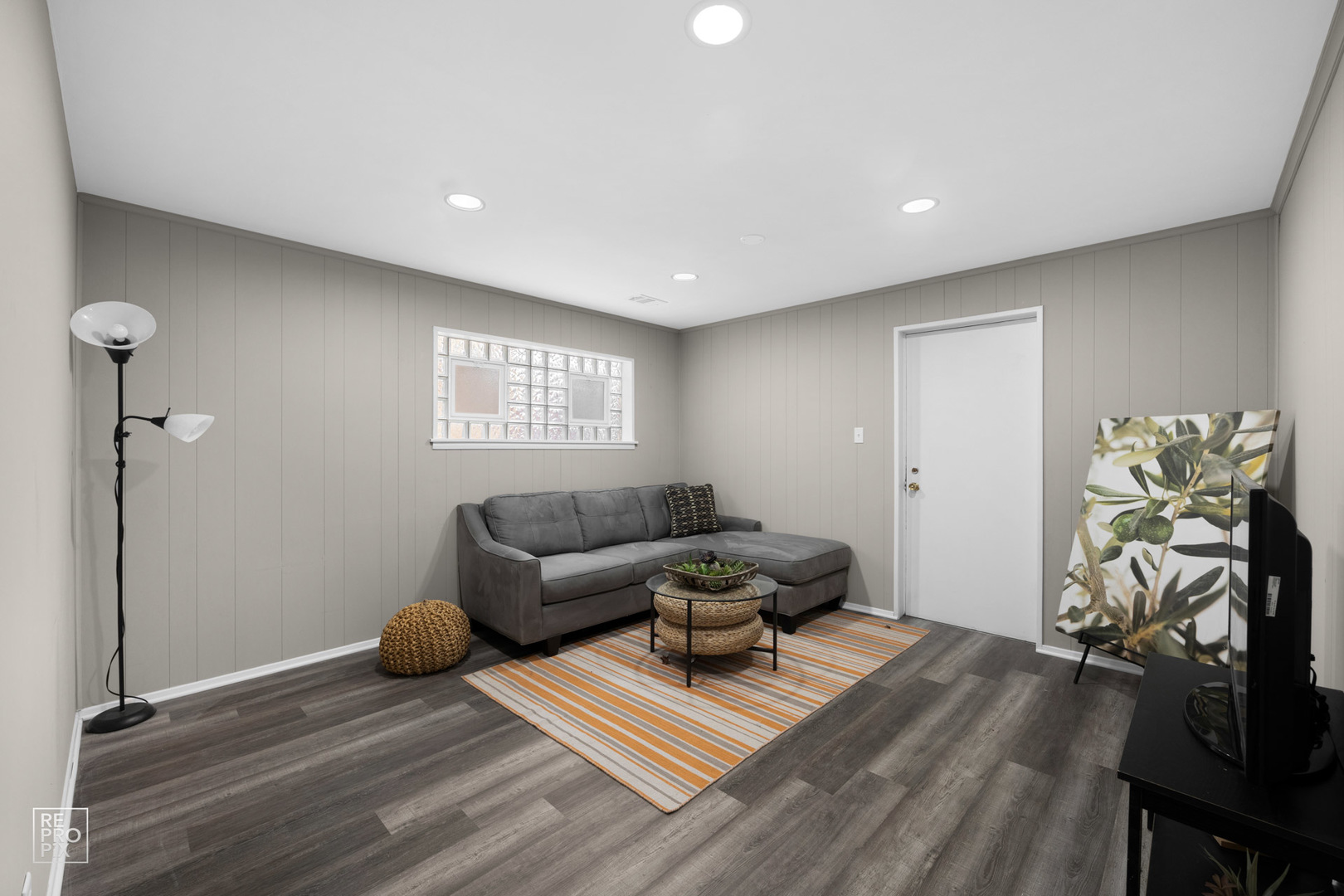 4319 West Devon Avenue Chicago, IL 60646 - Photo 9 of 10 a living room with furniture and a wooden floor