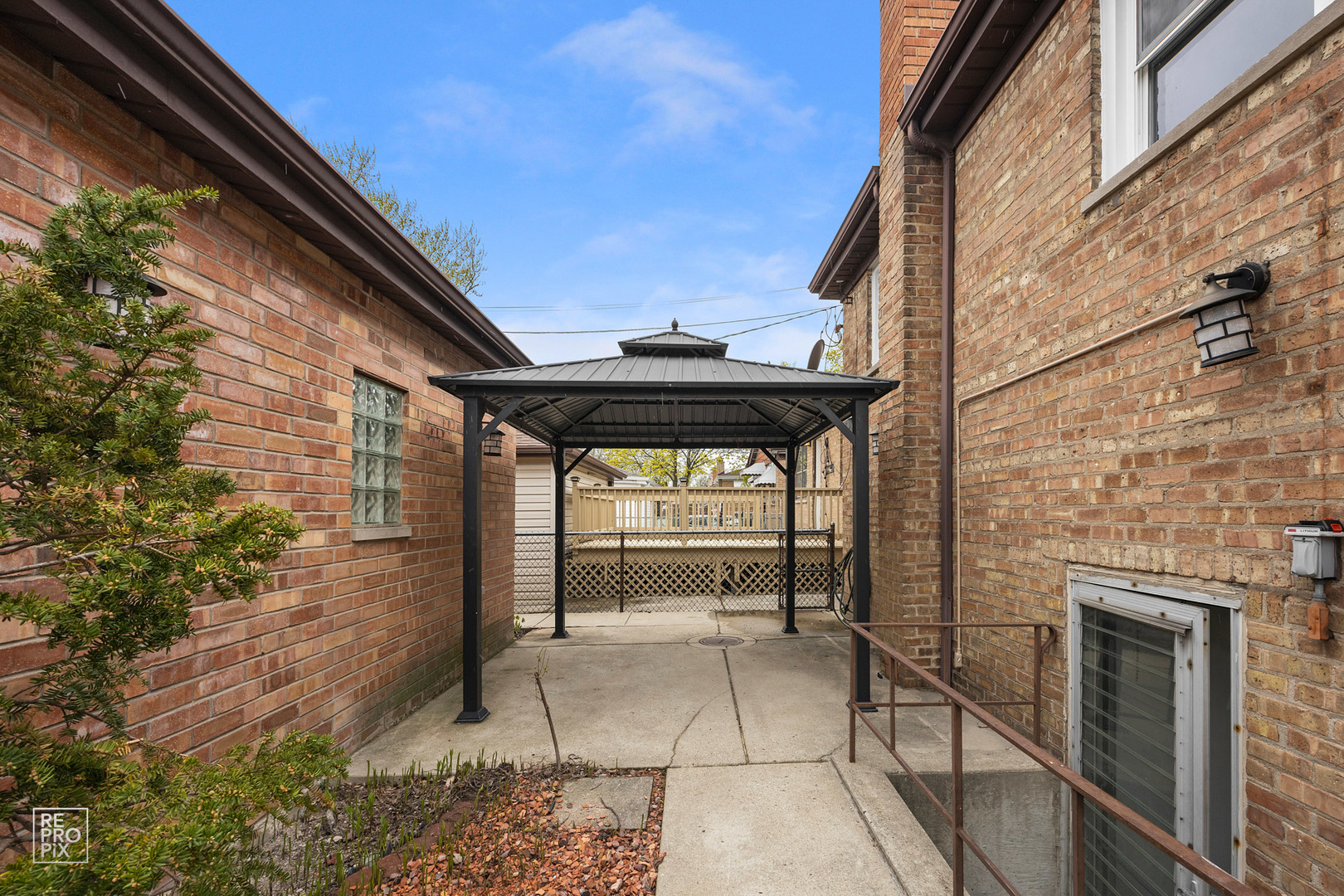 4319 West Devon Avenue Chicago, IL 60646 - Photo 10 of 10 a view of patio with a table and chairs and a floor to ceiling window with wooden floor