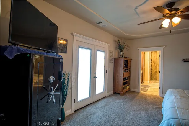 a view of a chairs and table in backyard
