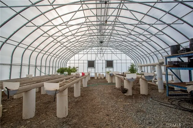 a view of a backyard with chairs