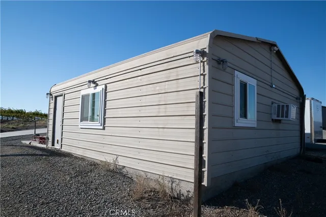 a view of a yard with an outdoor space