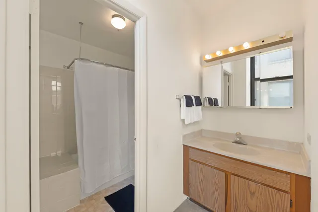 a bathroom with a sink double vanity and a mirror