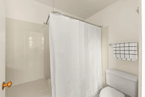 a bathroom with a shower curtain