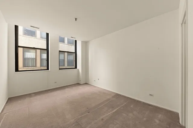 a view of empty room with windows