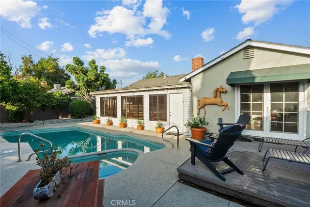 a backyard of a house with outdoor seating