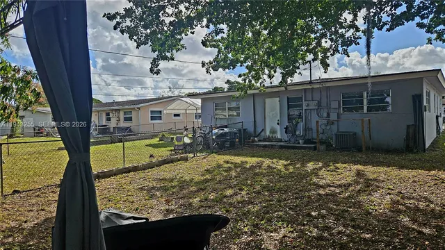 a view of house with swimming pool