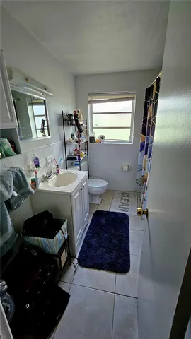 a bathroom with a sink toilet and tub