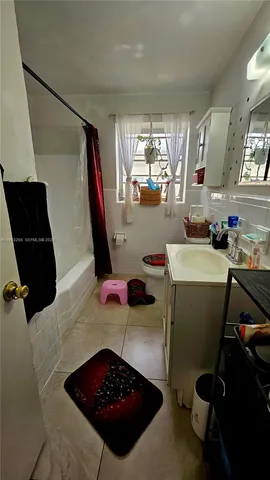 a room with furniture and a mirror