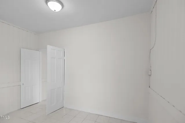 a bathroom with a shower sink vanity and mirror
